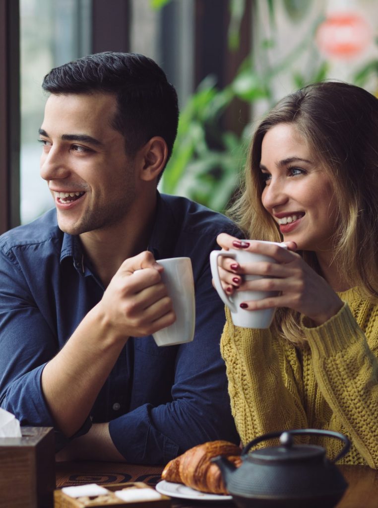 Couple in love drinking coffee in coffee shop